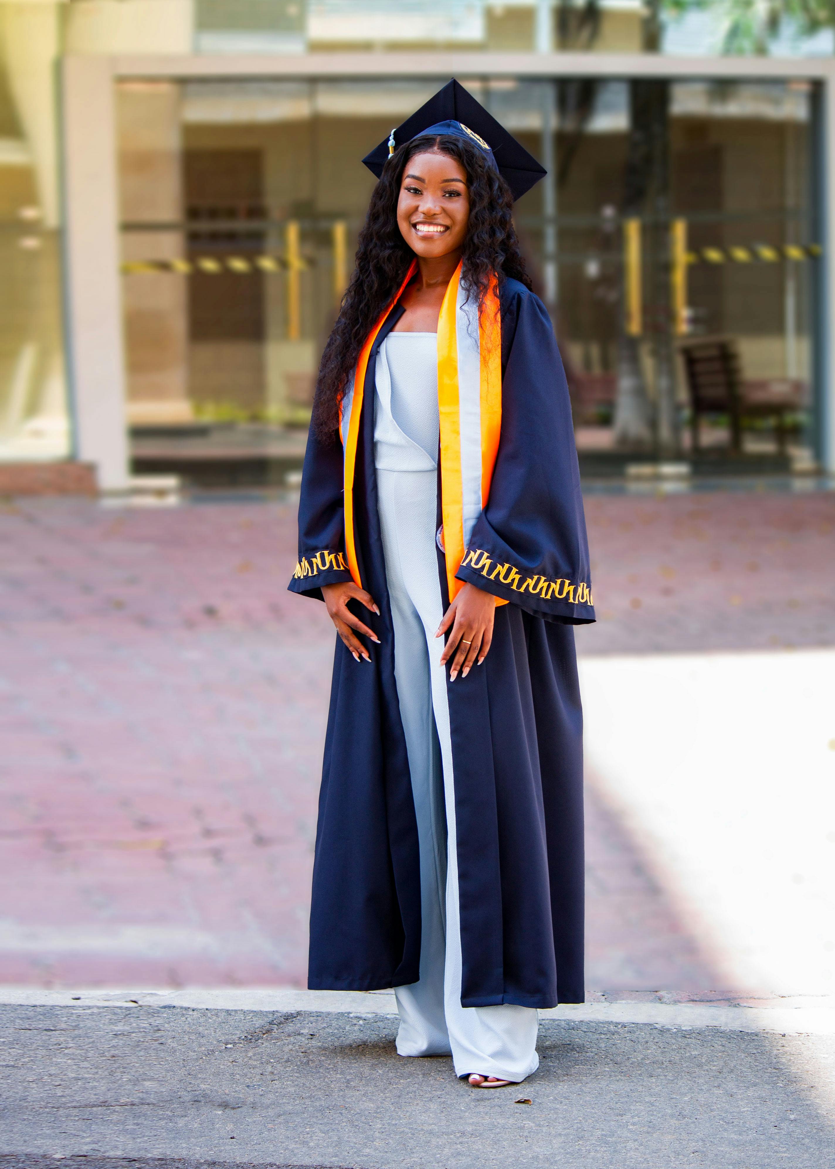 Portrait Of A Smiling Little Girl In Graduation Gown And Mortarboard Stock  Photo, Picture and Royalty Free Image. Image 203110742.